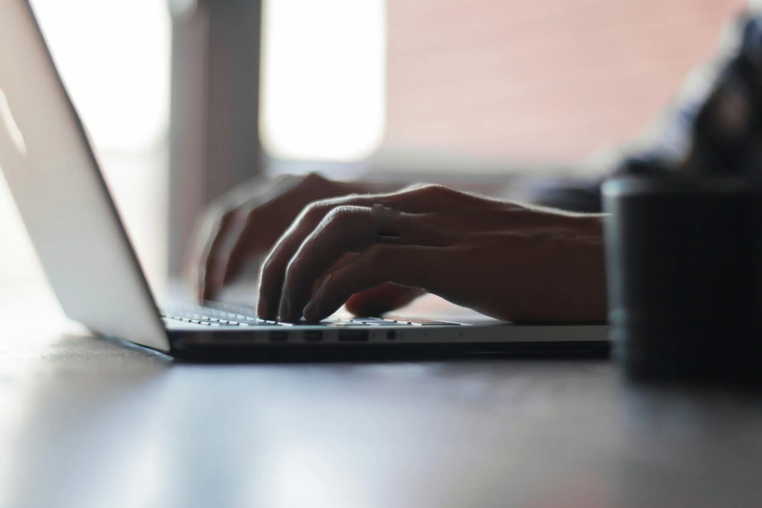 Man Typing - GM Allison class action lawsuit, Mahoney Law Group, personal injury