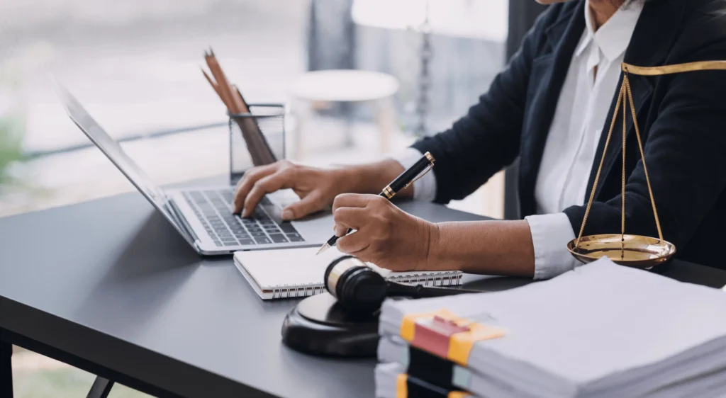 Attorney Writing at Mahoney Law Group, Long Beach Law Firm